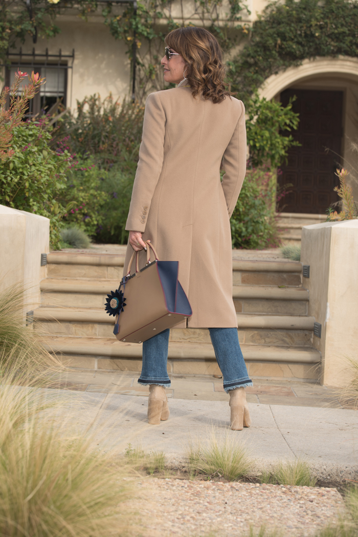 Givenchy Coat, Co Sweater, Rag and Bone Jeans, Stuart Weitzman Boots, Fendi Handbag, Miu Miu Sunglasses, Hermes Belt.