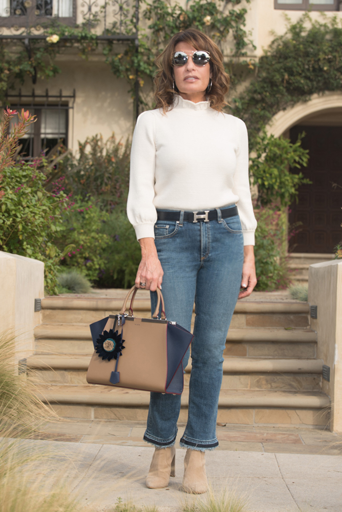 Givenchy Coat, Co Sweater, Rag and Bone Jeans, Stuart Weitzman Boots, Fendi Handbag, Miu Miu Sunglasses, Hermes Belt.