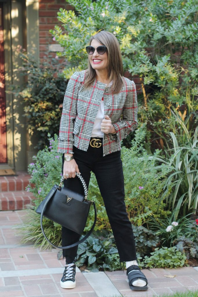 Oscar De La Renta Jacket, Sachin and Babi Top, Frame Jeans, Christian Dior High Tops, Chanel Shades, Louis Vuitton Handbag, Gucci Belt. 