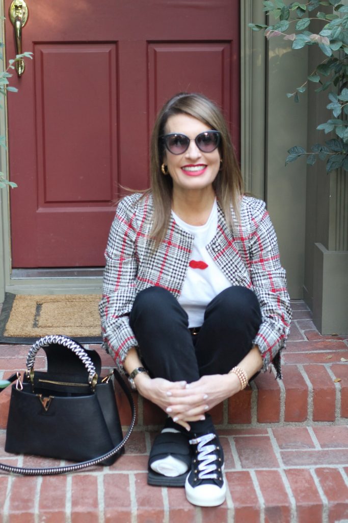 Oscar De La Renta Jacket, Sachin and Babi Top, Frame Jeans, Christian Dior High Tops, Chanel Shades, Louis Vuitton Handbag, Gucci Belt. 