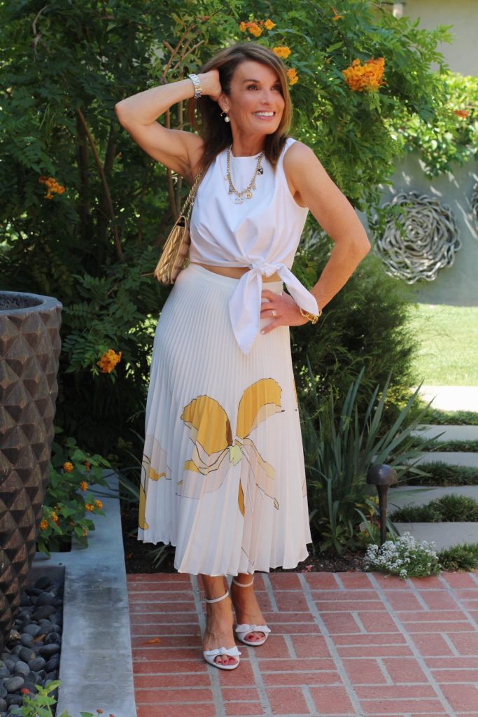 Reiss Skirt, Tibi Top, Tabitha Simmons Sandals, Gucci Shades, Kathryn Wagner Necklace, Oscar De La Renta Bracelet, Vintage Chanel Handbag.  