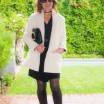 Sandro Coat, Dress, and Belt; Jimmy Choo Boots; Wolford Tights; Tom Ford Clutch; Zina Necklace; Robin Terman Chokers, Bracelets, and Earrings; Chloe Ring, Celine Sunglasses.