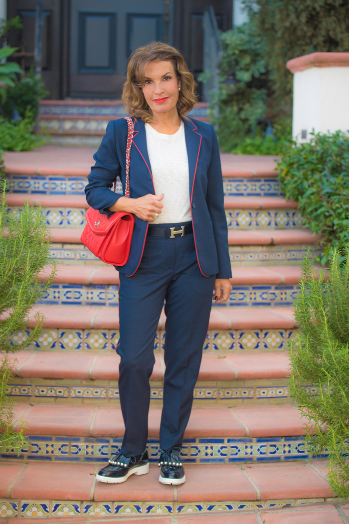 Sandro Pants and Jacket; Rag and Bone T-Shirt; Robert Clergerie Shoes; Hermes Belt; Chanel Handbag, Cuff, and Sunglasses; Christian Dior Earrings.