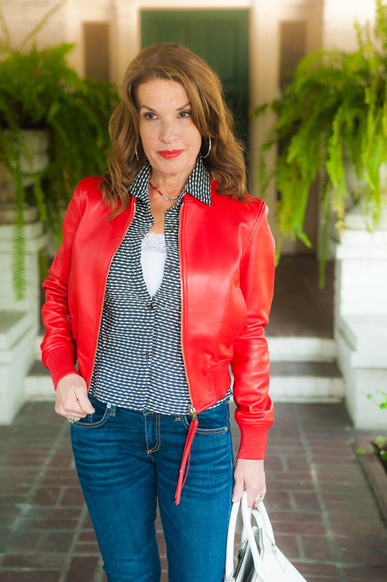 Bally Red Leather Jacket, Peter Cohen Top, Rag and Bone Jeans, Gianvito Rossi Shoes, Chanel Bracelet, Oliver Peoples Sunglasses, John Hardy Wrap Bracelet Worn as a Necklace.