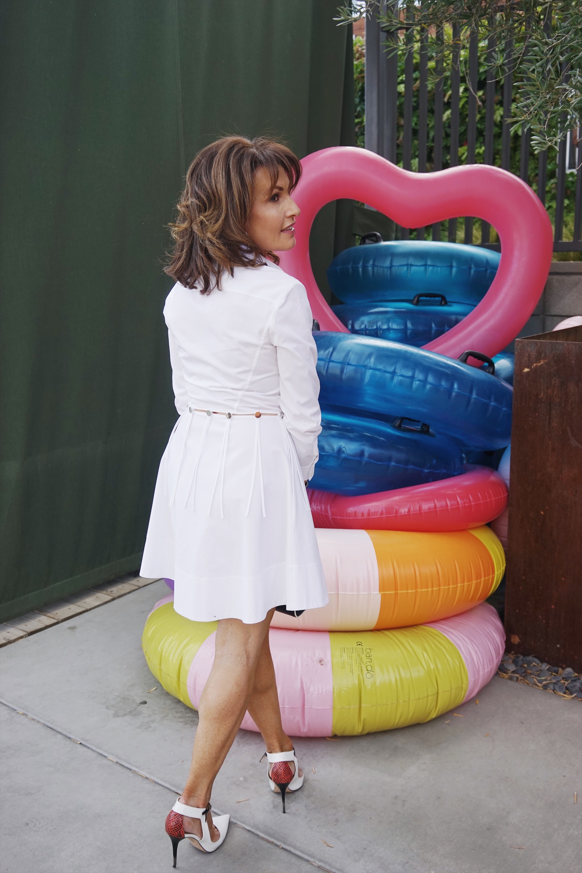 Alexander Wang dress, Jimmy Choo shoes, Fendi handbag, John Hardy hoops, Spinelli Kilcollin ring.