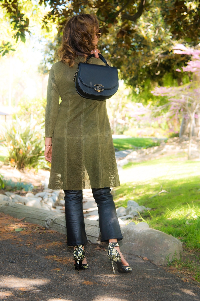 Artico Jacket, AG Pants, The Row Tank Top, The Row Heels, Balenciaga Choker, Monique Pean Ring, Chanel Handbag, Oliver Peoples Sunglasses.