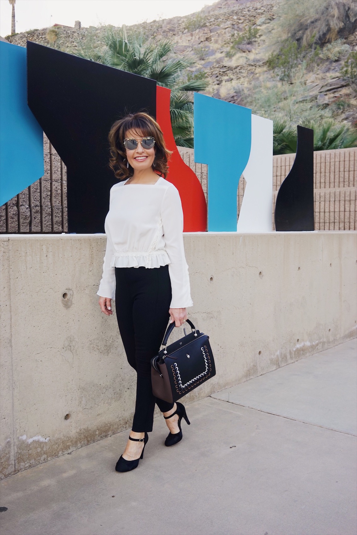 Fendi Sweater Coat, Phillip Lim Blouse, Rag and Bone Pants, Chanel Shoes, Fendi Bag, The Jewelry Bar Earrings, Miu Miu Shades.