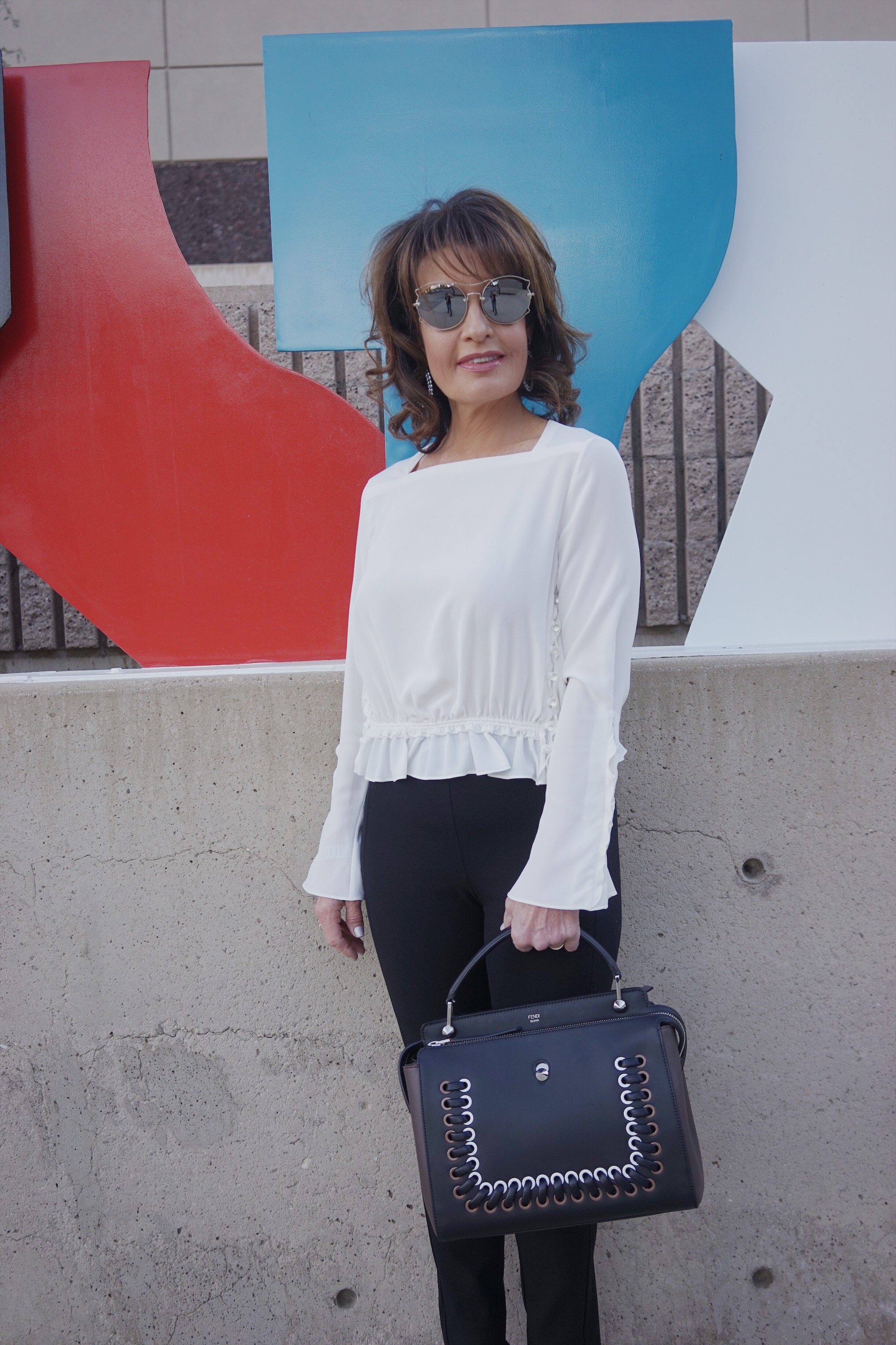 Fendi Sweater Coat, Phillip Lim Blouse, Rag and Bone Pants, Chanel Shoes, Fendi Bag, The Jewelry Bar Earrings, Miu Miu Shades.