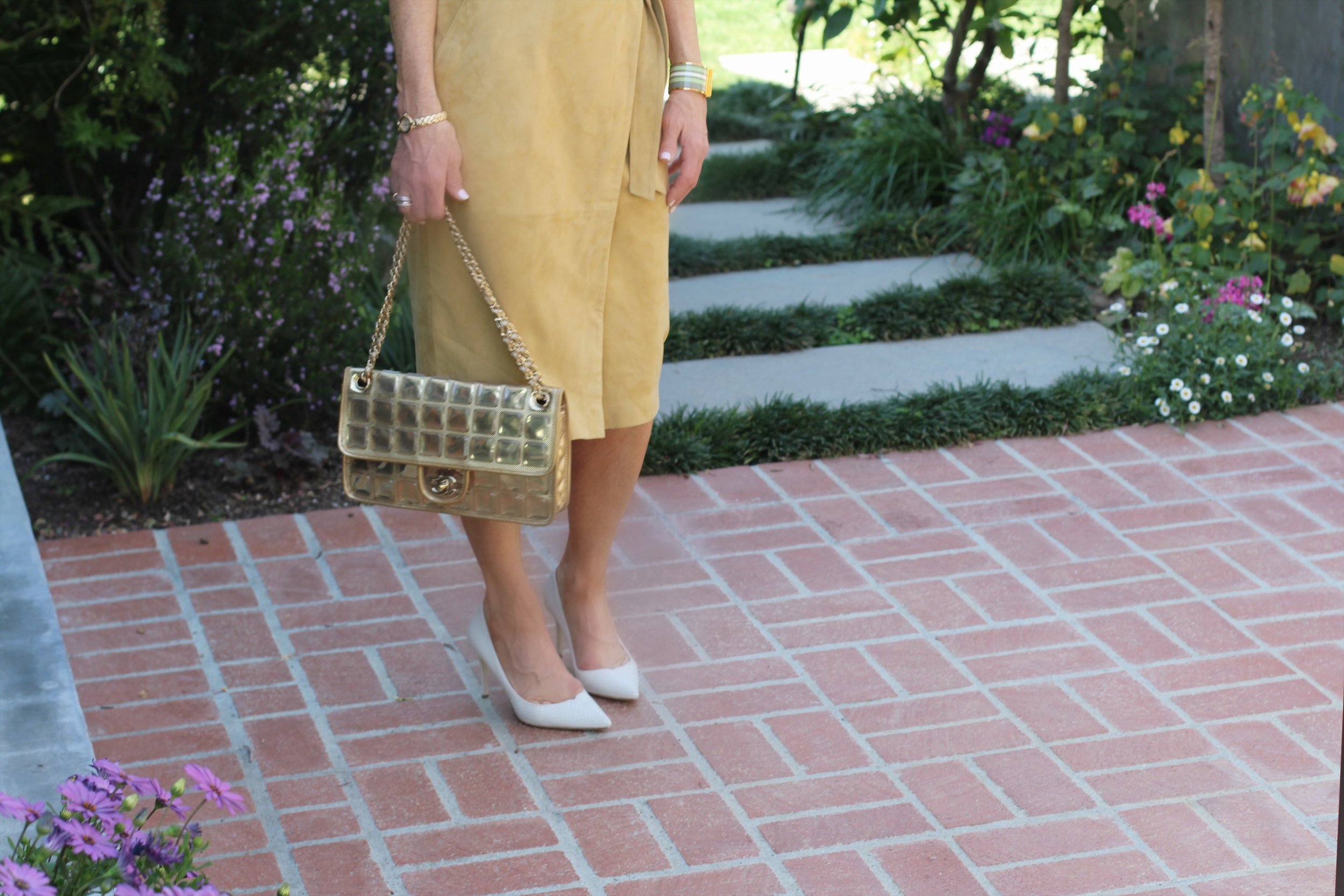 Ralph Lauren Blouse, Ba&Sh Skirt, Giuseppe Zanotti Heels, Chanel Handbag, Hermes Cuff, Gucci Sunglasses, Madewell Earrings, Meyrav Shavit Necklace, Spinelli Kilcollin Ring.