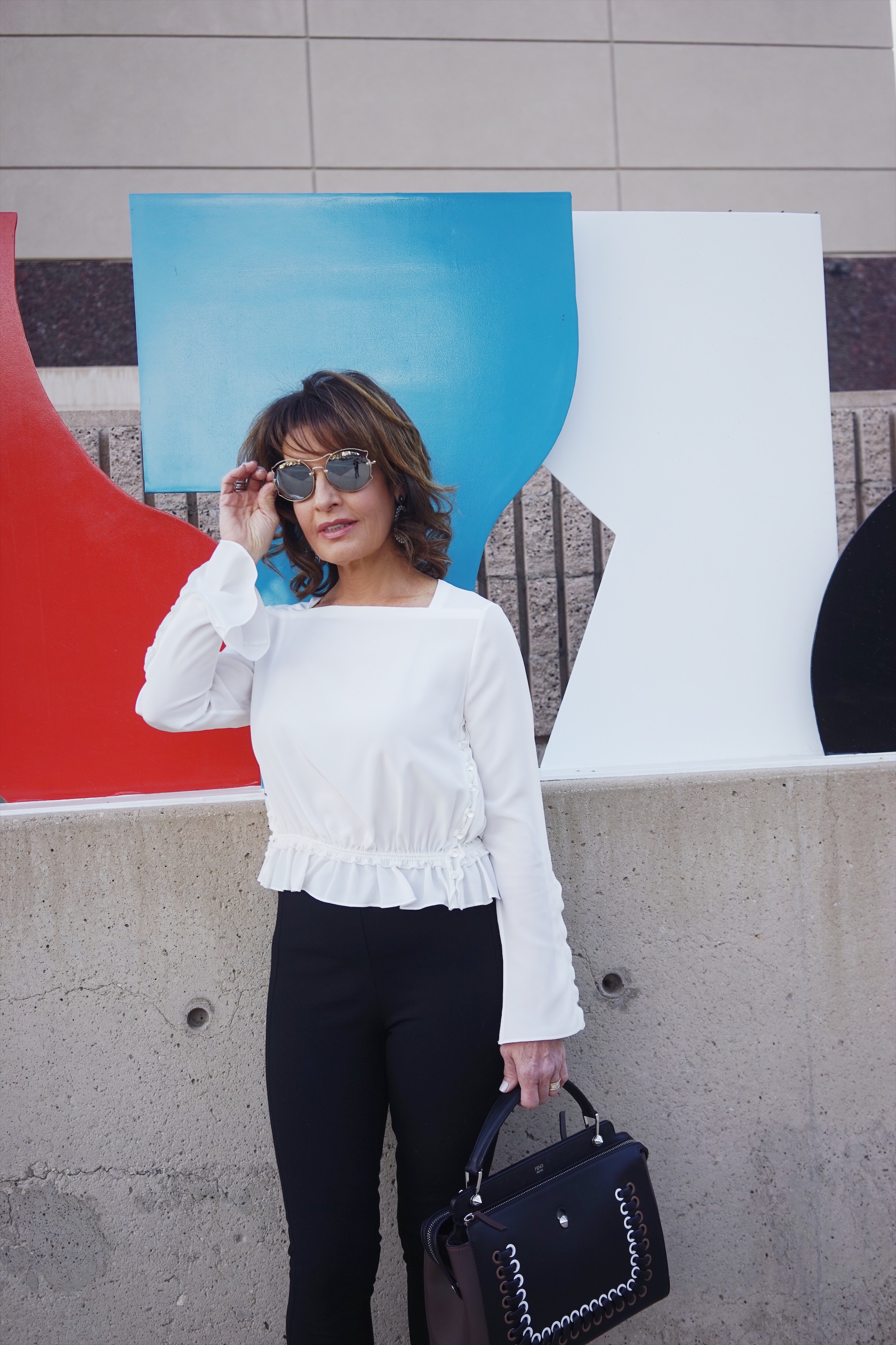 Fendi Sweater Coat, Phillip Lim Blouse, Rag and Bone Pants, Chanel Shoes, Fendi Bag, The Jewelry Bar Earrings, Miu Miu Shades.