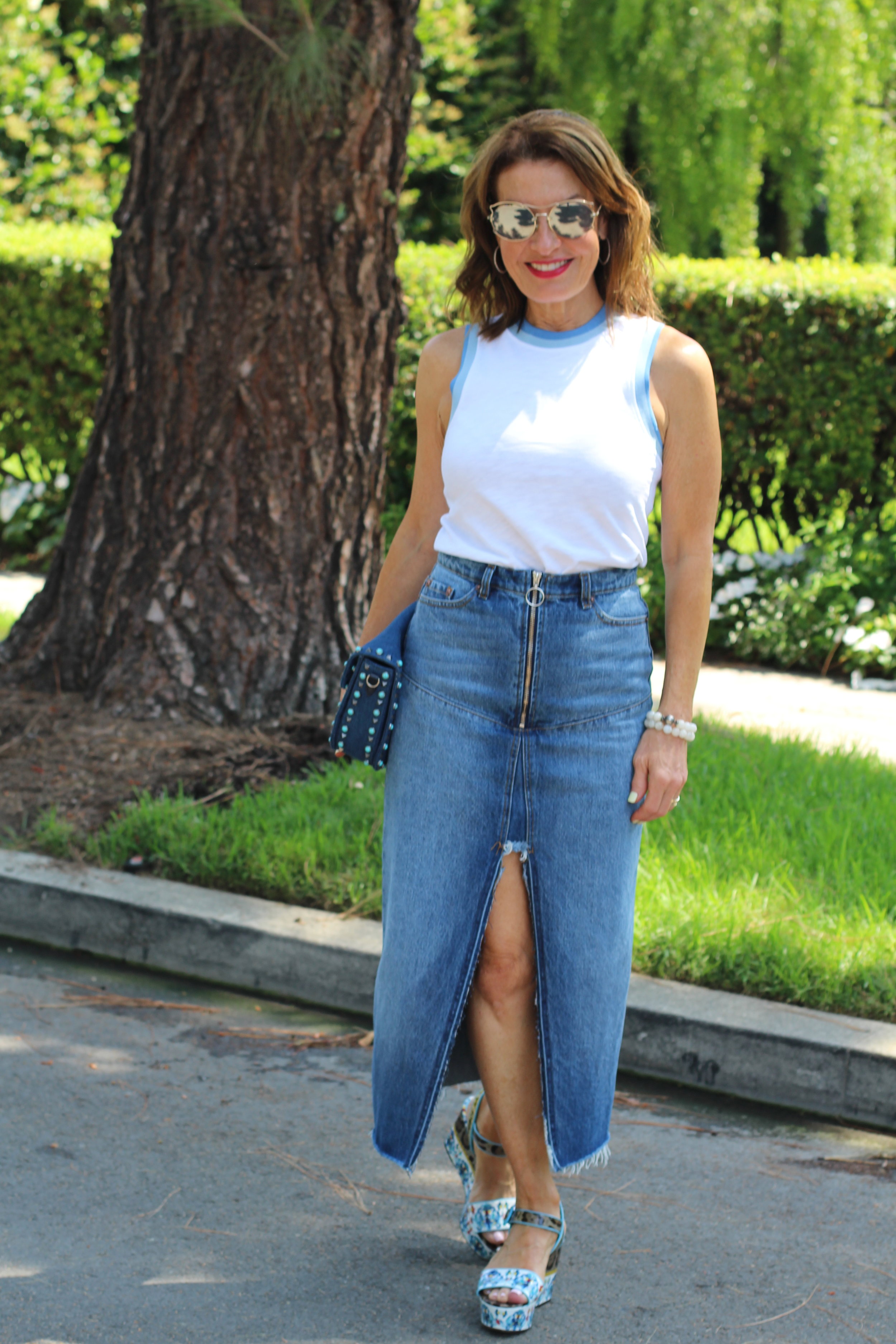 The Kooples Denim Skirt, Rag and Bone Shirt, Dolce and Gabanna Sandals, Valentino Handbag, Miu Miu Sunglasses, The Jewelry Bar bracelets.