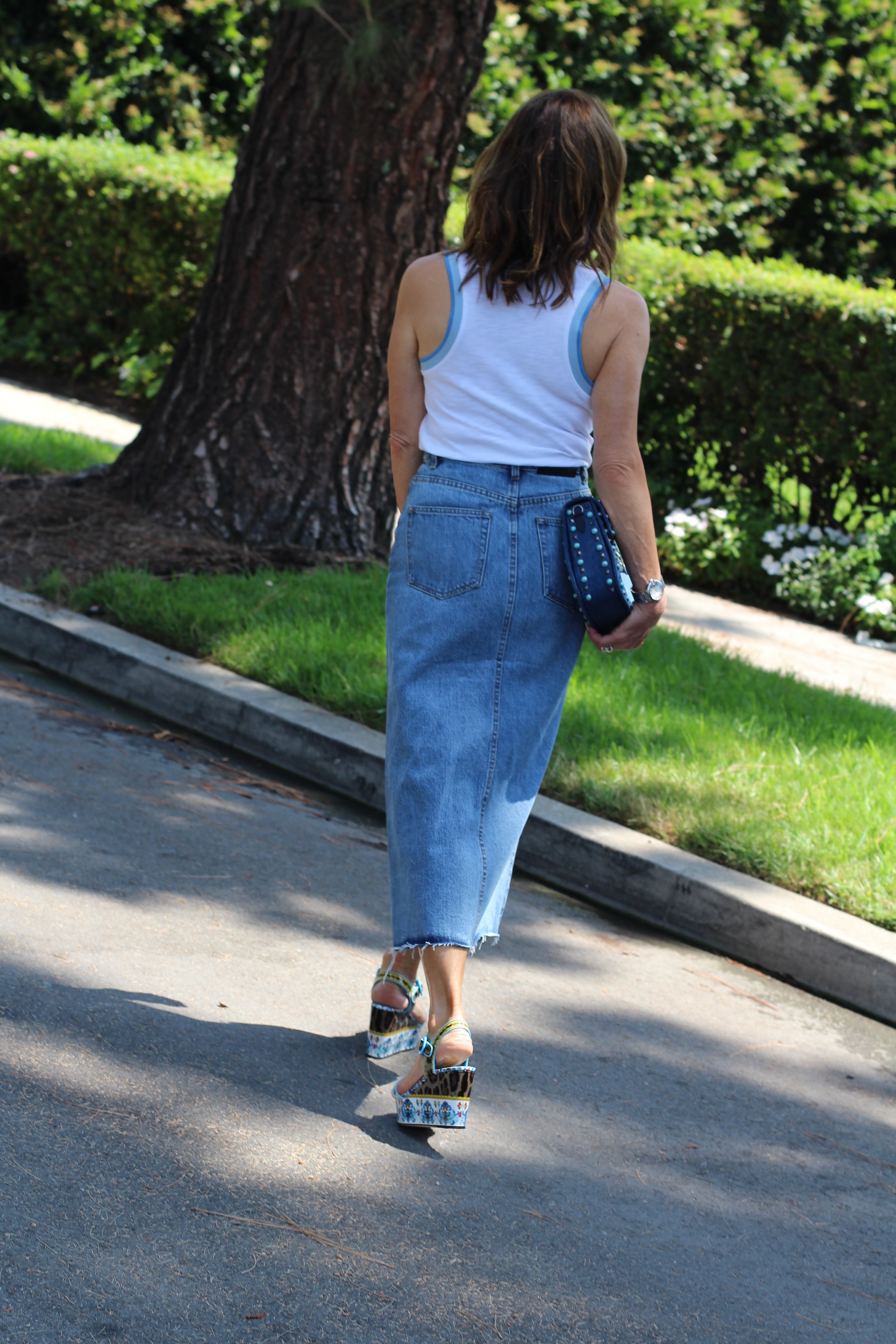 The Kooples Denim Skirt, Rag and Bone Shirt, Dolce and Gabanna Sandals, Valentino Handbag, Miu Miu Sunglasses, The Jewelry Bar bracelets.