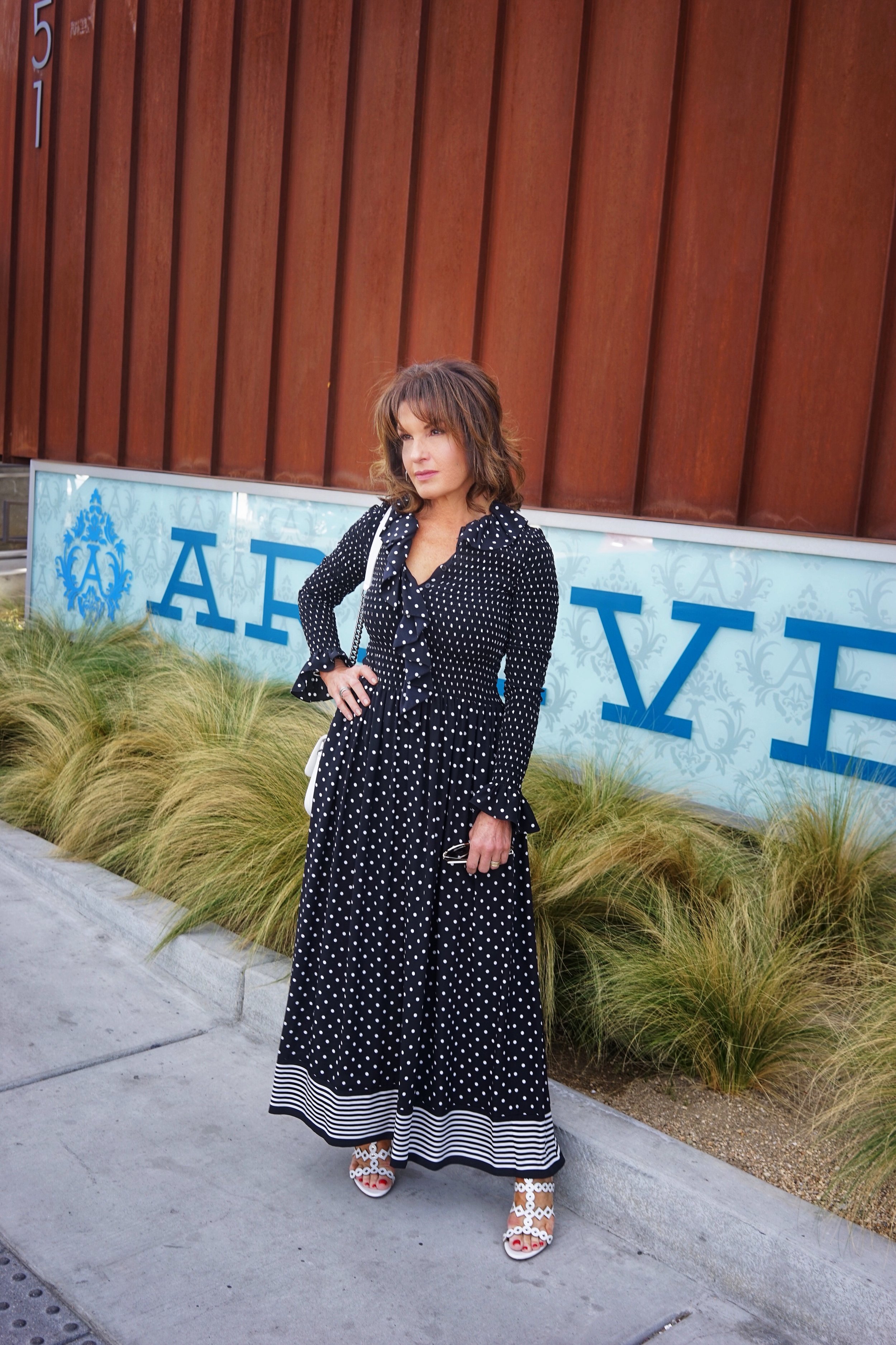 Stella McCartney Jumpsuit, Chanel Handbag, Alaia Sandals,   Miu Miu Shades, John Hardy Hoops .