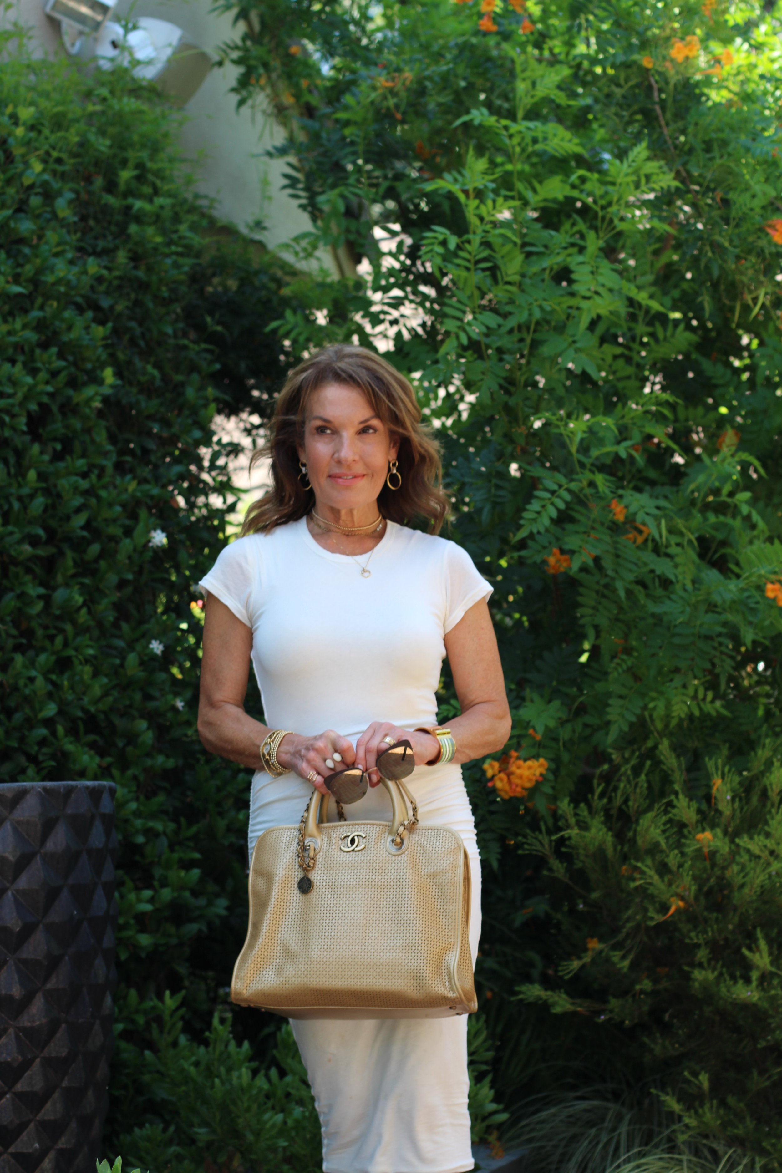 James Pearse Dress, Gucci Sandals, Chanel Handbag, Hermes Cuff, Robin Terman Gold Beaded Choker and Bracelets, Tova Malibu Gold Choker, Madewell Earrings.