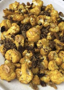 Turmeric Roasted Cauliflower with Raisins and Crispy Quinoa