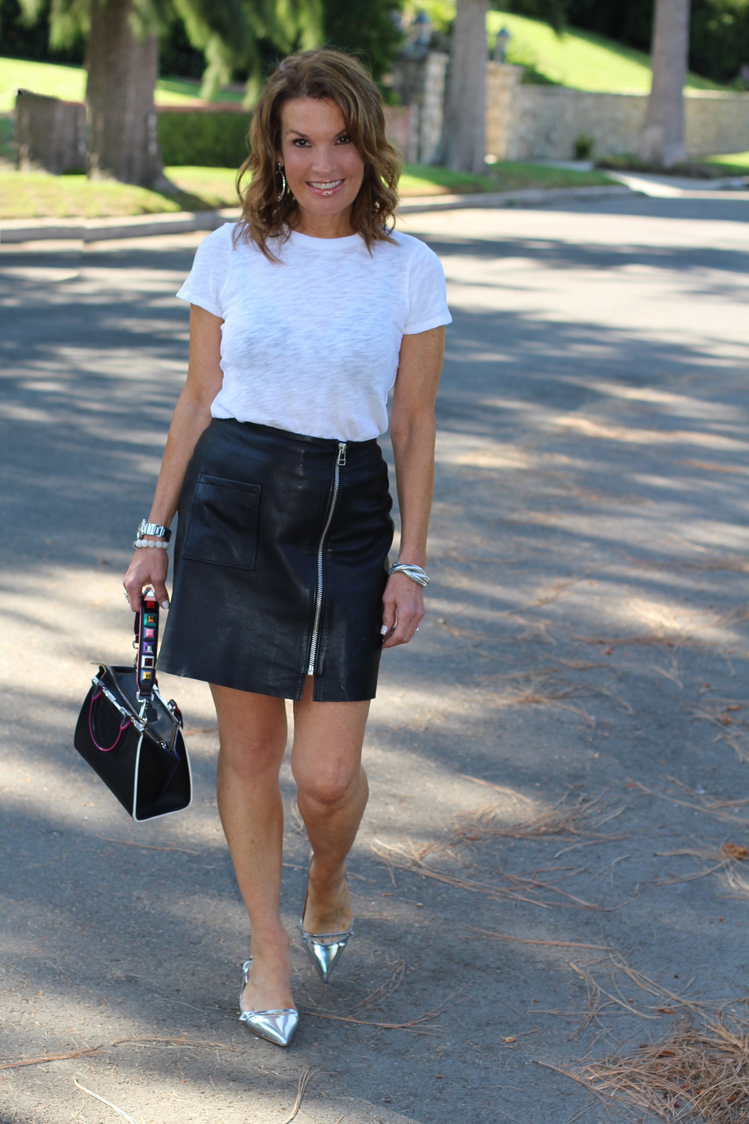 ATM T-shirt, Tiger of Sweden Skirt, Maui Jim Sunglasses, Tabitha Simmons Shoes, Fendi Handbag, Spinelli Kilcollin Ring, The Jewelry Bar bracelets, John Hardy Earrings.