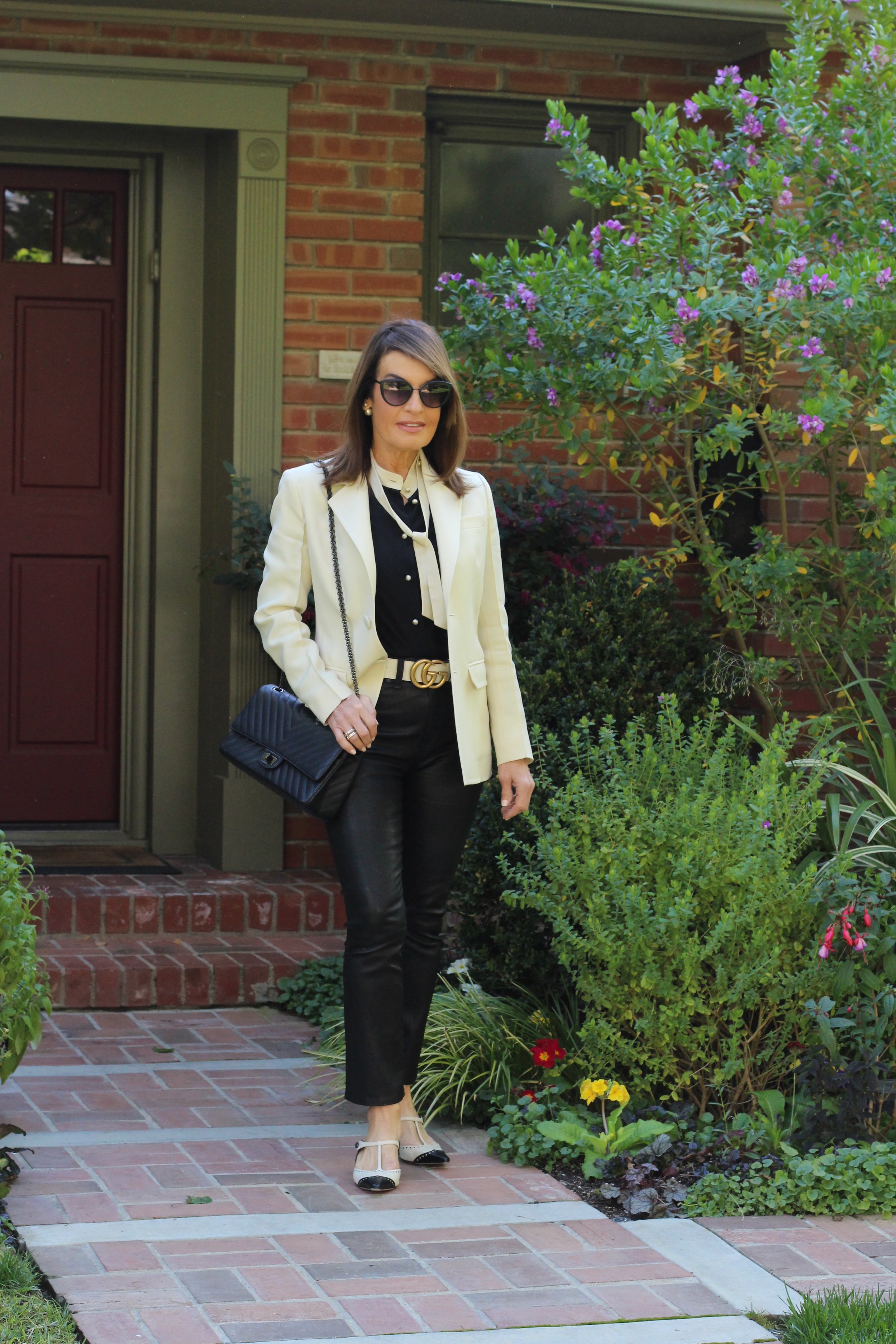 Bally Blazer, Gucci Blouse and Belt, Rag and Bone Leather Jeans, Dior Mules and Tribal Earrings, Spinelli Kilcollin Ring, Chanel handbag and Sunglasses.