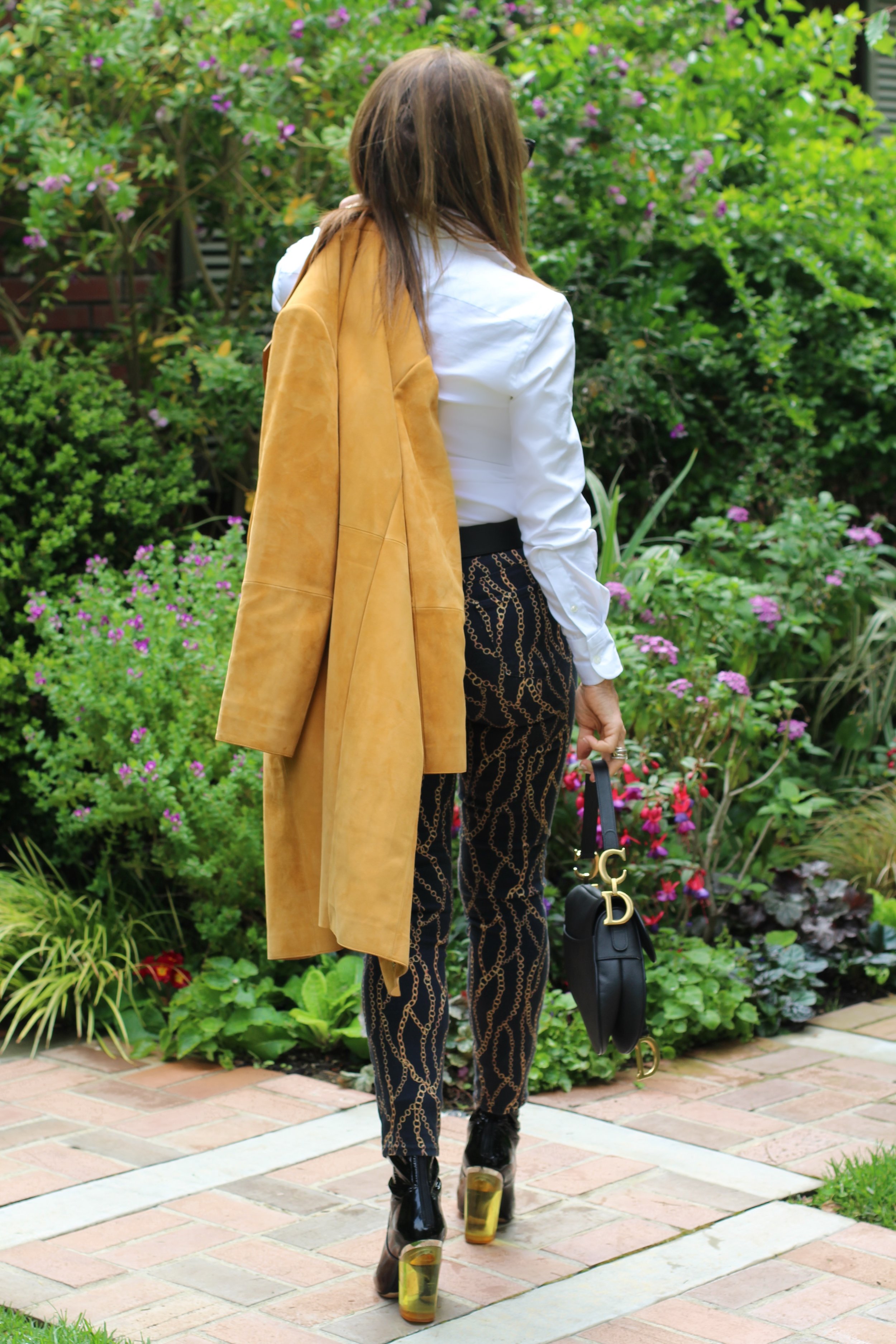  Theory Coat, Ralph Lauren Blouse, Gucci Belt, L’Agence Jeans, Christian Dior Boots and Handbag, Safia Day Necklace, Robin Terman Earrings, Bracelets by Molly, Chanel Shades.