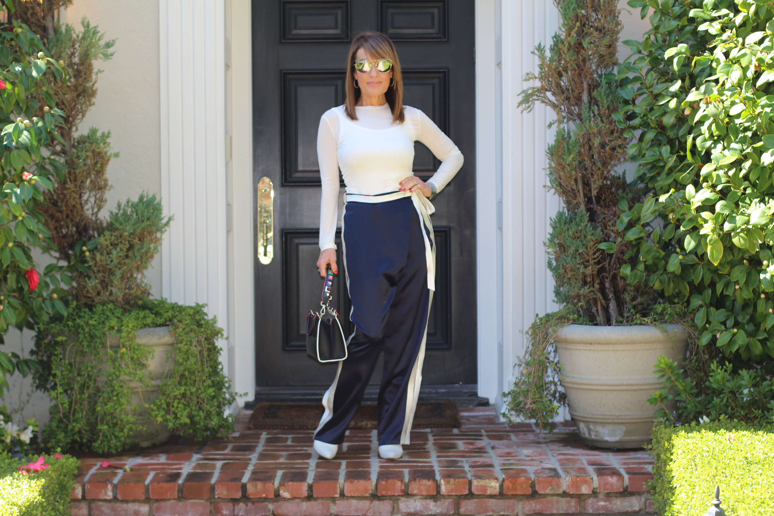 Dion Lee Pants, Max Mara Tank and Top, Iro Jacket, Stuart Weitzman Boots , Fendi Handbag.