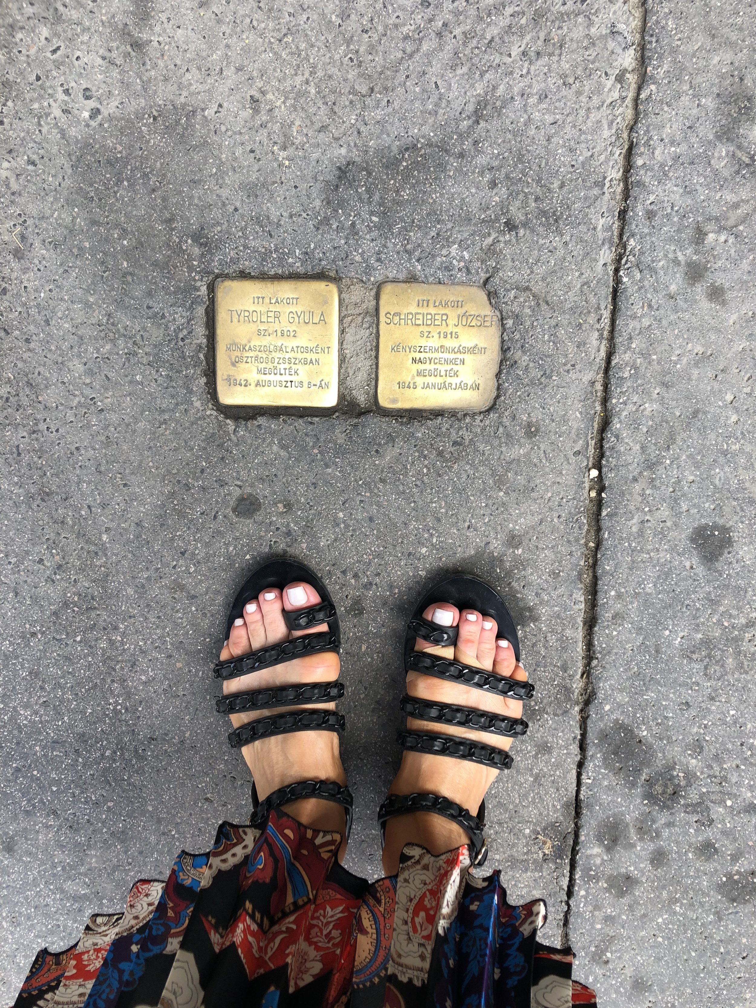 Plaques marking the names of Jewish families who lived there before they were taken. 