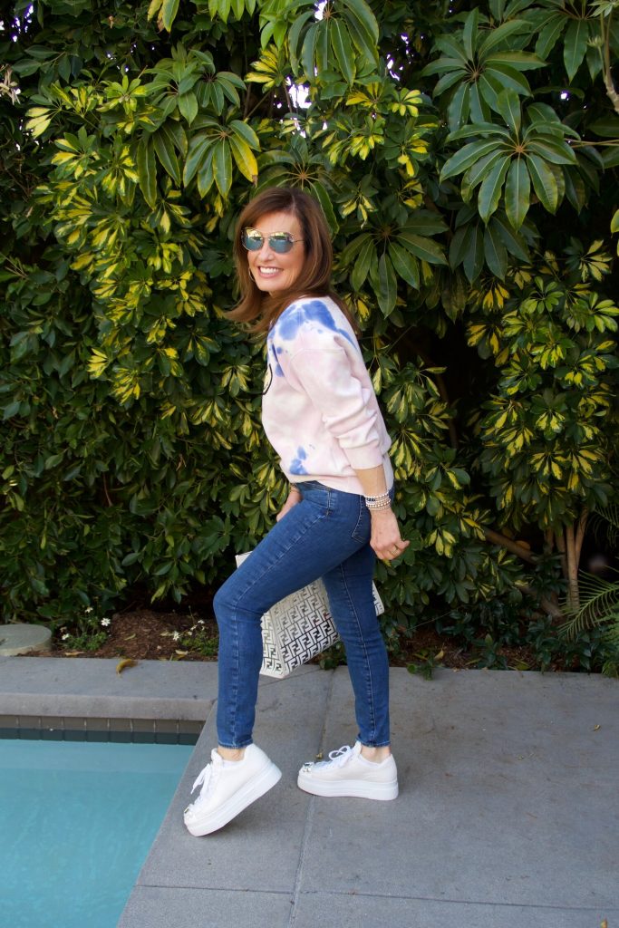 Not Your Daughter's Jeans, Miu Miu Sneakers, and Fendi Runaway Bag.