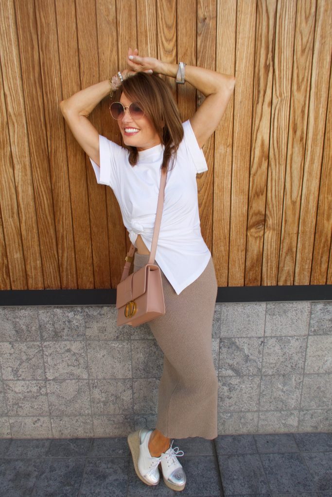 A Long Knit Skirt and Short White Tee.
