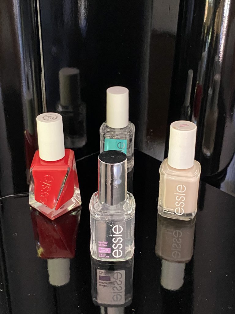 Essie Nail Products:  Gel Couture in Rock The Runway, 
Here To Stay Base Polish, Essie Ballet Slippers, Speed Setter.