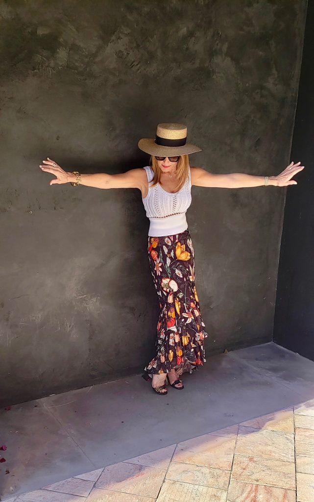 Philip Lim Top, Atelier 17-56 Skirt, Gucci Hat, Bottega Veneta Sunglasses, Gucci Sandals, Dior Handbag, Oscar De La Renta Chain Bracelet (Right Arm), Jewels By Molly Sydney Stretch Bracelets (Left Arm). 