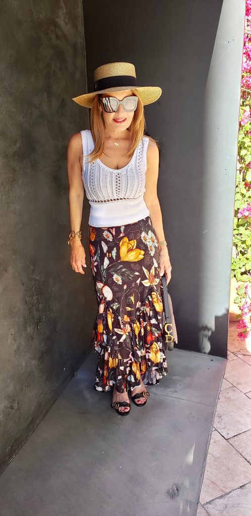 Philip Lim Top, Atelier 17-56 Skirt, Gucci Hat, Bottega Veneta Sunglasses, Gucci Sandals, Dior Handbag, Oscar De La Renta Chain Bracelet (Right Arm), Jewels By Molly Sydney Stretch Bracelets (Left Arm).